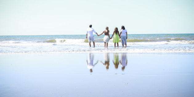 Healthy family on a beach with energy